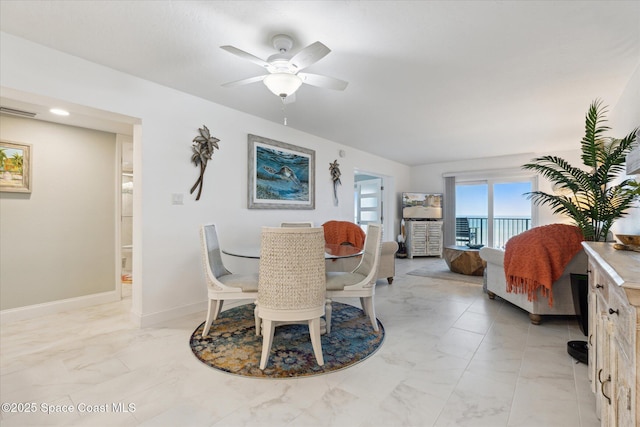 dining room featuring visible vents, baseboards, marble finish floor, and ceiling fan