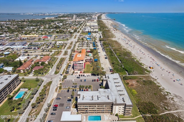 bird's eye view featuring a beach view and a water view