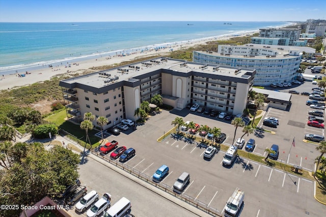 aerial view featuring a beach view and a water view