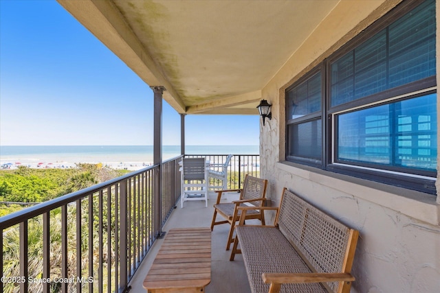 balcony featuring a water view