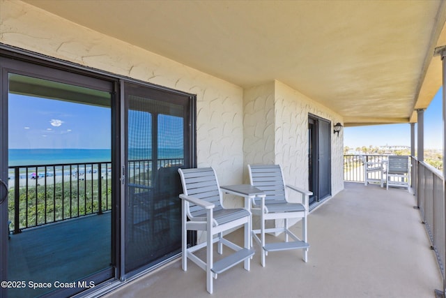 balcony featuring a water view