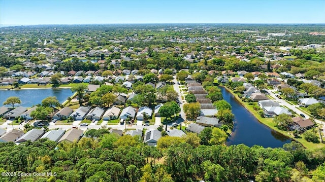 birds eye view of property featuring a residential view and a water view