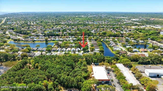 bird's eye view with a residential view and a water view