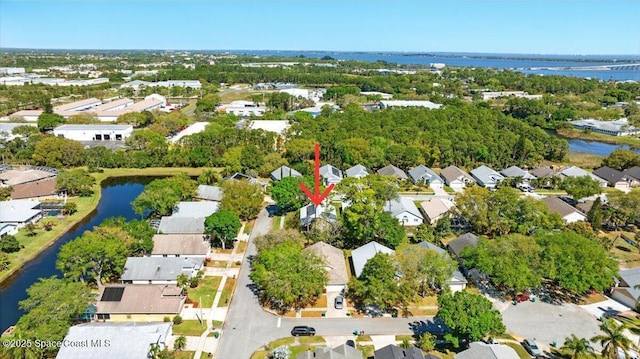 bird's eye view with a residential view and a water view