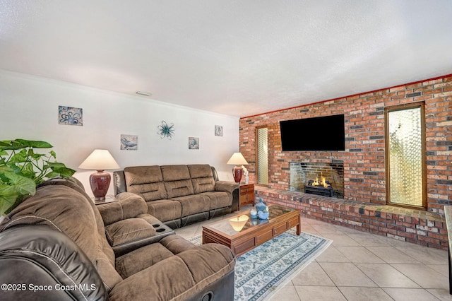 living area with light tile patterned flooring, a brick fireplace, a textured ceiling, and crown molding