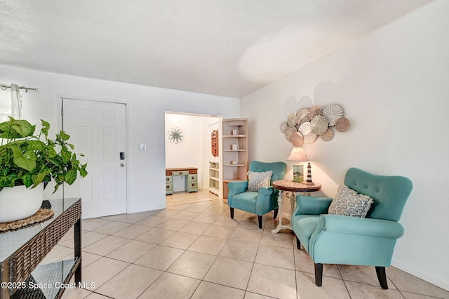 living area featuring light tile patterned floors