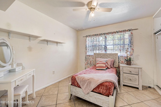 bedroom with light tile patterned floors, baseboards, and ceiling fan