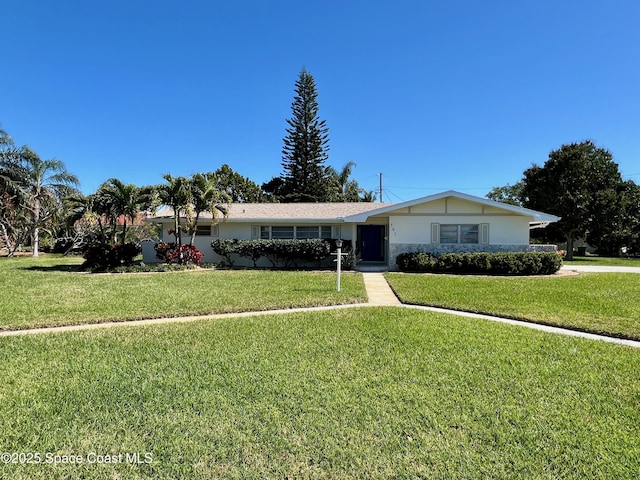 ranch-style home with a front lawn