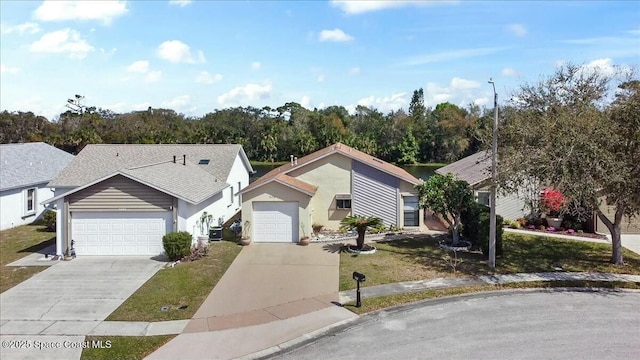 ranch-style house featuring stucco siding, a shingled roof, concrete driveway, a front yard, and an attached garage