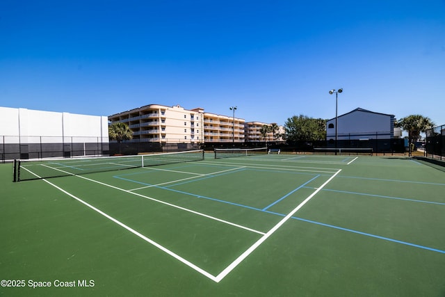 view of sport court with community basketball court and fence