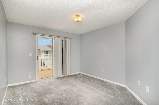 211 Cherie Down Ln, Cape Canaveral, FL 32920 - spare room with carpet and a textured ceiling