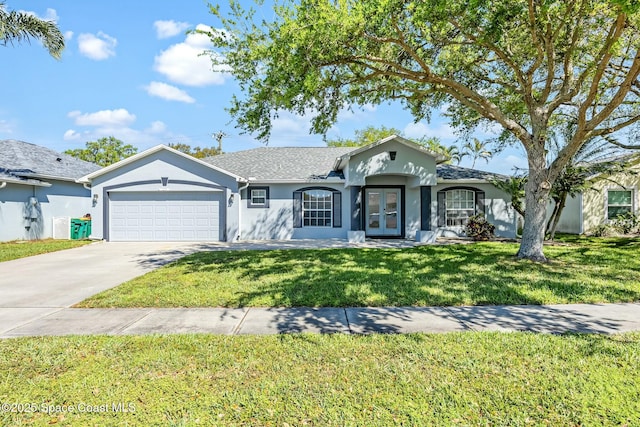 single story home featuring stucco siding, a front lawn, concrete driveway, and a garage