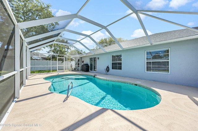 view of swimming pool with a patio area, a fenced in pool, and fence