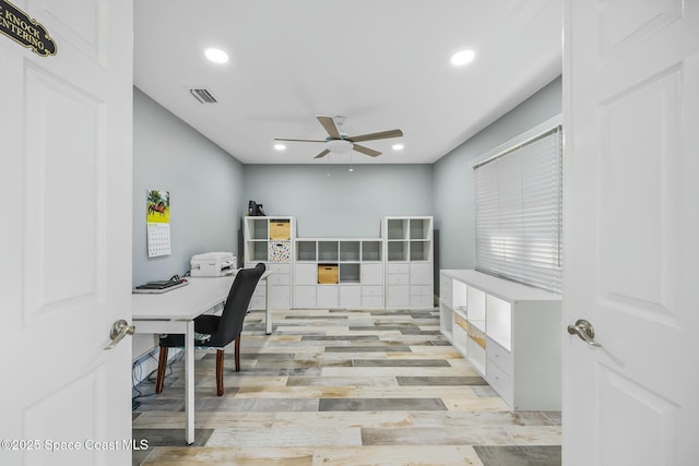 office area featuring light wood-style flooring, recessed lighting, a ceiling fan, and visible vents