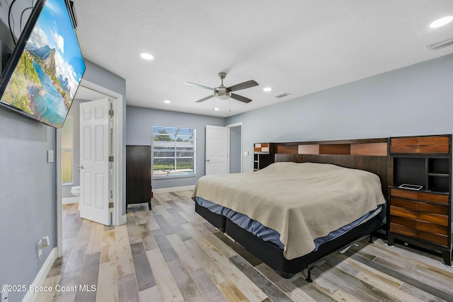 bedroom with recessed lighting, visible vents, baseboards, and light wood-style floors