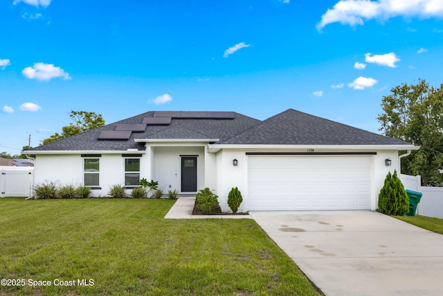 view of front of home featuring stucco siding, driveway, and a front lawn