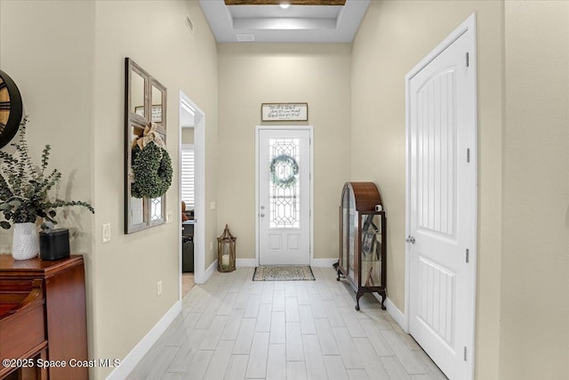 entryway with visible vents, baseboards, and light wood finished floors