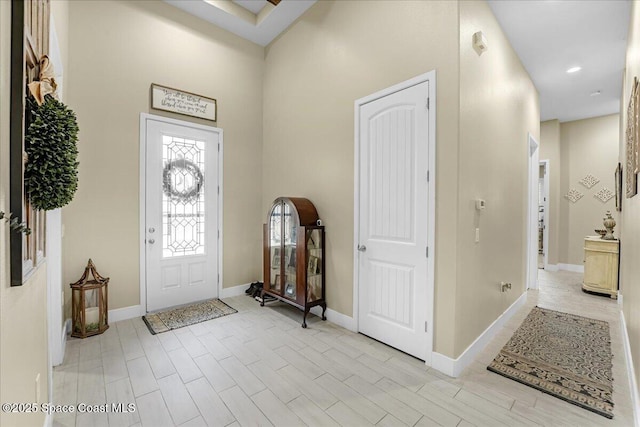 entryway with recessed lighting, light wood-type flooring, and baseboards