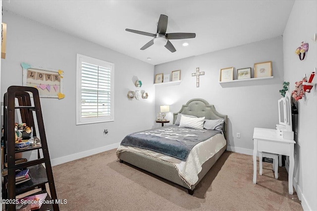 carpeted bedroom with baseboards and ceiling fan