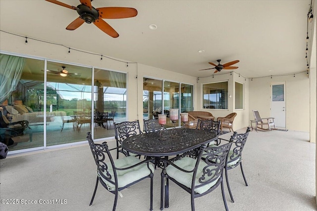 view of patio / terrace with outdoor dining area and ceiling fan