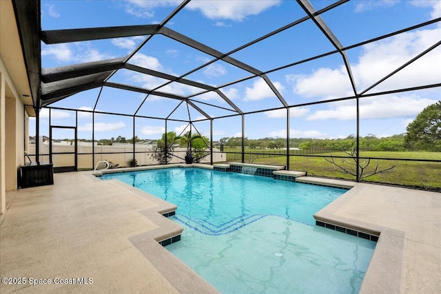 pool featuring glass enclosure, a patio, and a yard