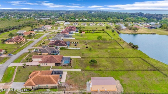 birds eye view of property featuring a residential view and a water view