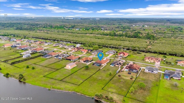 birds eye view of property featuring a water view and a residential view