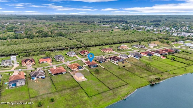 bird's eye view featuring a residential view and a water view