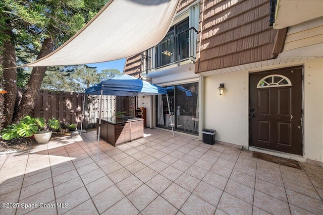 view of patio featuring fence