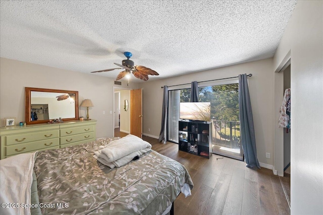 bedroom with access to exterior, a textured ceiling, wood finished floors, baseboards, and ceiling fan