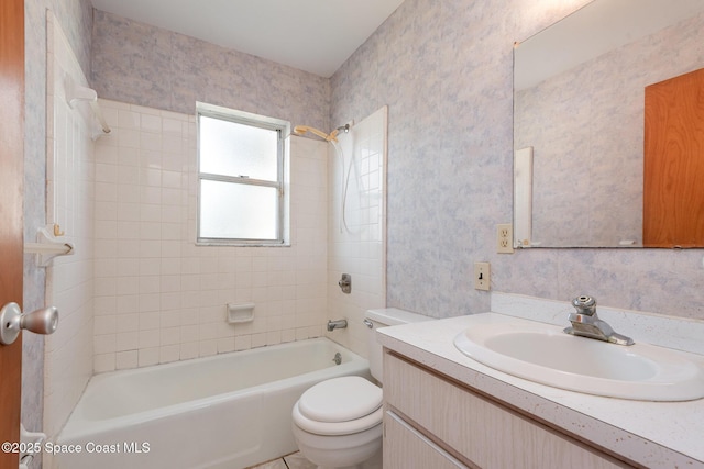 full bathroom featuring shower / washtub combination, toilet, wallpapered walls, and vanity