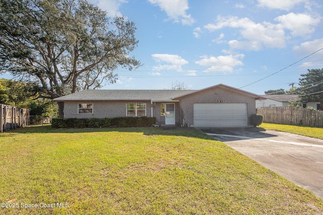 ranch-style home with driveway, a front lawn, an attached garage, and fence