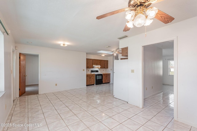 unfurnished living room with light tile patterned flooring, visible vents, baseboards, and ceiling fan