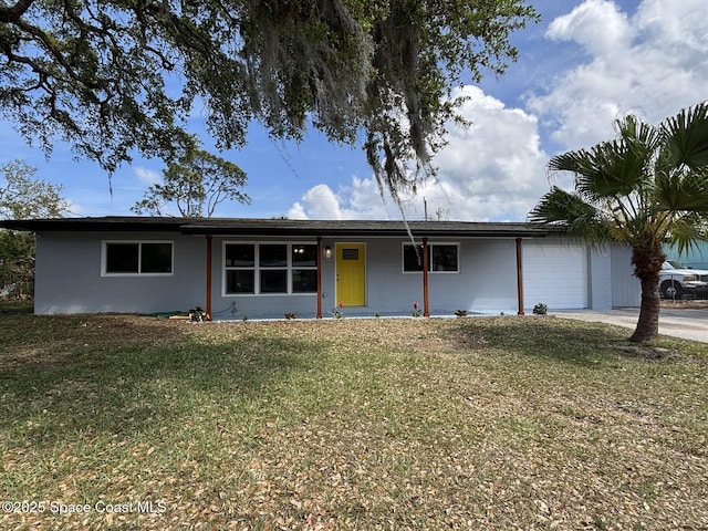 single story home with a front lawn and an attached garage