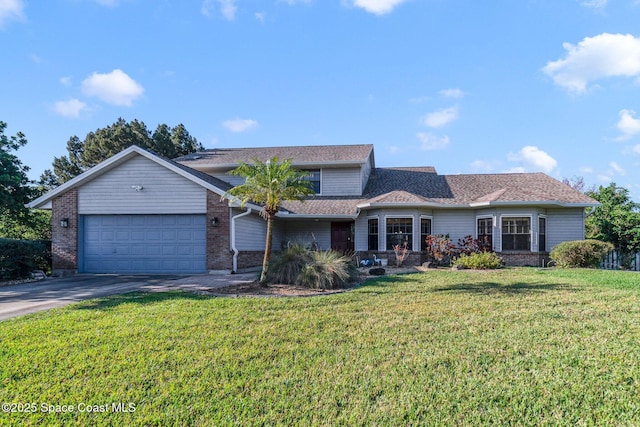 traditional-style house with concrete driveway, a garage, brick siding, and a front lawn