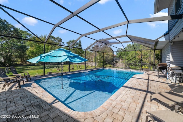 pool featuring a lanai and a patio area