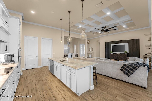 kitchen featuring light wood-type flooring, a ceiling fan, coffered ceiling, open floor plan, and white cabinets