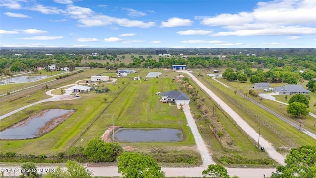 aerial view with a water view and a rural view