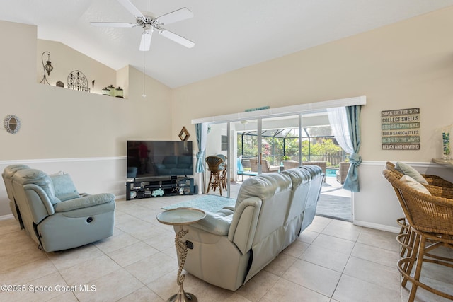 living area featuring baseboards, high vaulted ceiling, ceiling fan, and light tile patterned flooring