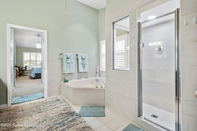 full bathroom with tile patterned flooring, a bath, a ceiling fan, and a stall shower