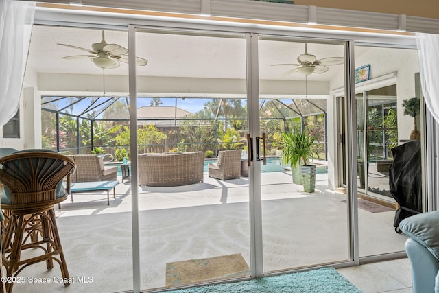 sunroom / solarium with a wealth of natural light and ceiling fan