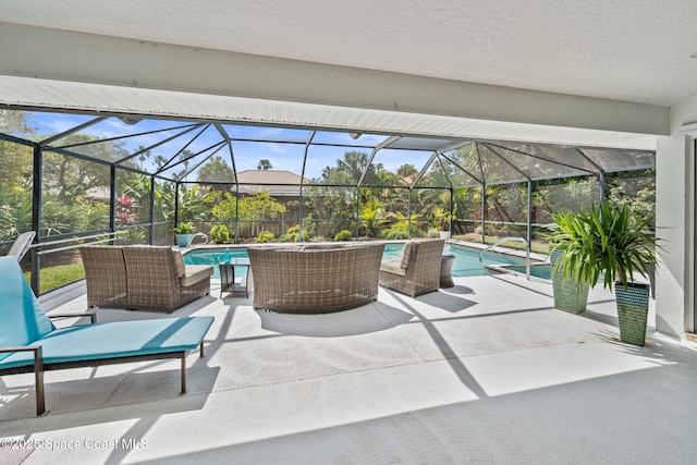 view of patio with an outdoor pool and glass enclosure