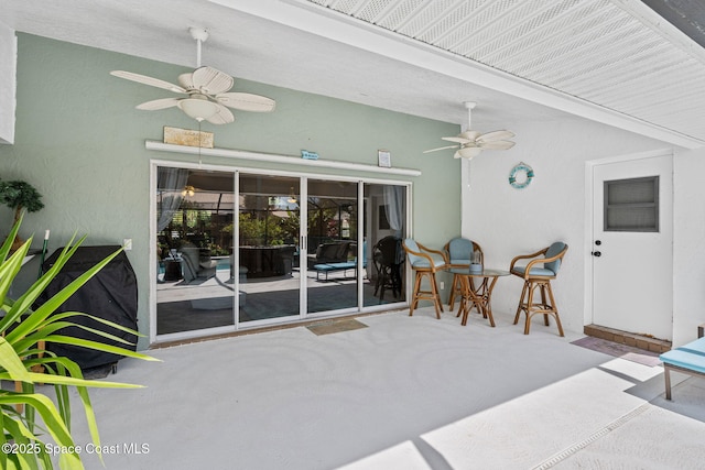 view of patio featuring a ceiling fan