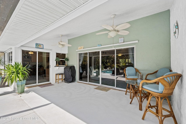 view of patio featuring ceiling fan