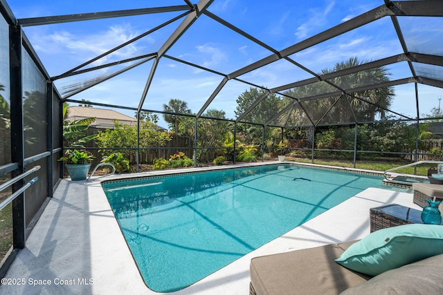 view of pool featuring a patio and a pool with connected hot tub