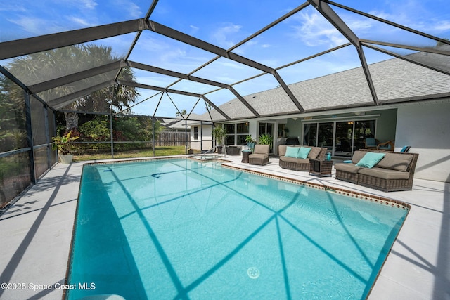 pool featuring a patio, a lanai, and an outdoor hangout area