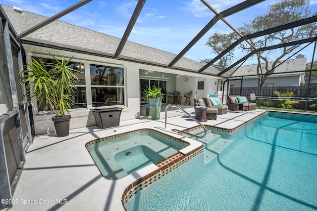 view of swimming pool with a pool with connected hot tub, ceiling fan, a lanai, an outdoor hangout area, and a patio area