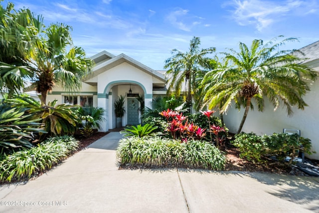 doorway to property with stucco siding