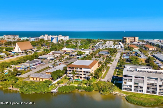 drone / aerial view with a view of city and a water view