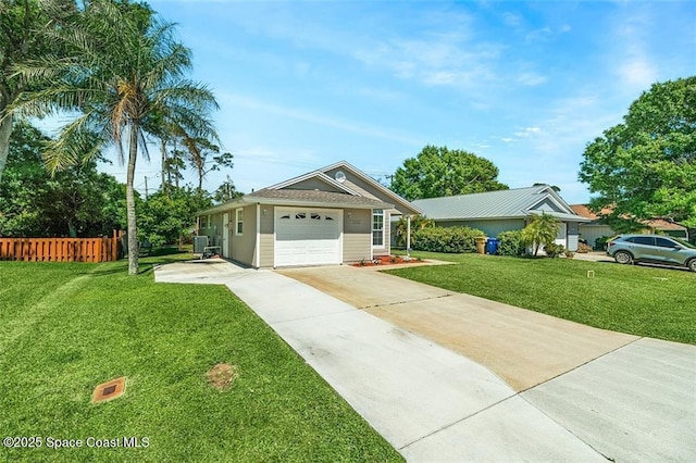 ranch-style house featuring a front yard, concrete driveway, fence, and a garage